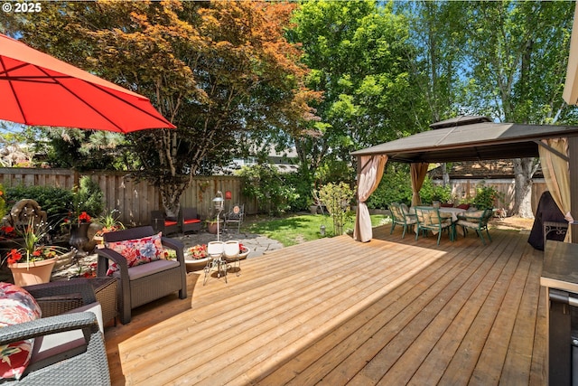 16165 NW Blueridge Dr, Beaverton, OR 97006 - wooden terrace with a gazebo, outdoor lounge area, outdoor dining area, and a fenced backyard
