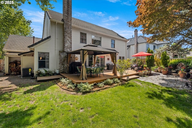 16165 NW Blueridge Dr, Beaverton, OR 97006 - back of property with a gazebo, a wooden deck, a lawn, and outdoor dining area