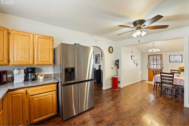 kitchen with stainless steel refrigerator with ice dispenser, dark hardwood / wood-style flooring, and ceiling fan with notable chandelier