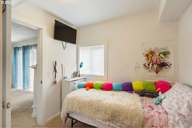 carpeted bedroom featuring multiple windows