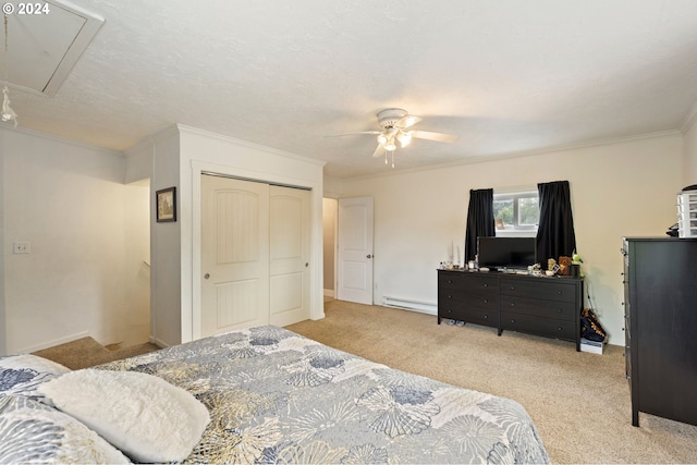 carpeted bedroom featuring ceiling fan, a baseboard radiator, a closet, a textured ceiling, and ornamental molding