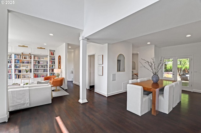 dining area with wood finished floors, recessed lighting, baseboards, french doors, and ornate columns