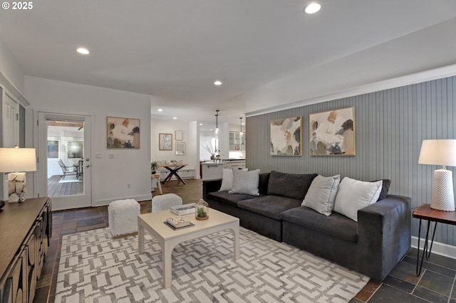 living room featuring recessed lighting and baseboards