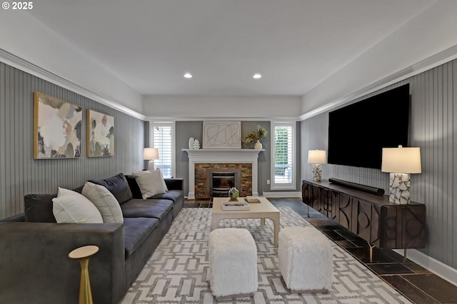 living area featuring healthy amount of natural light, a fireplace, recessed lighting, and baseboards