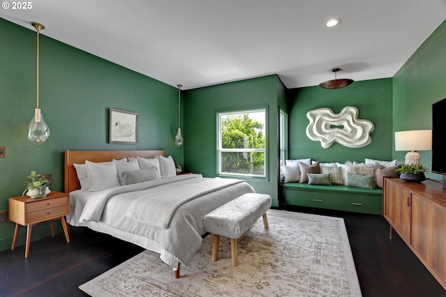 bedroom with dark wood-style floors and recessed lighting