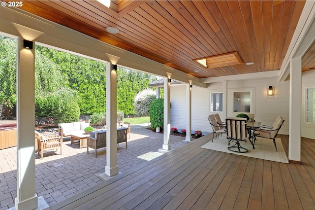 wooden terrace with outdoor lounge area and outdoor dining space