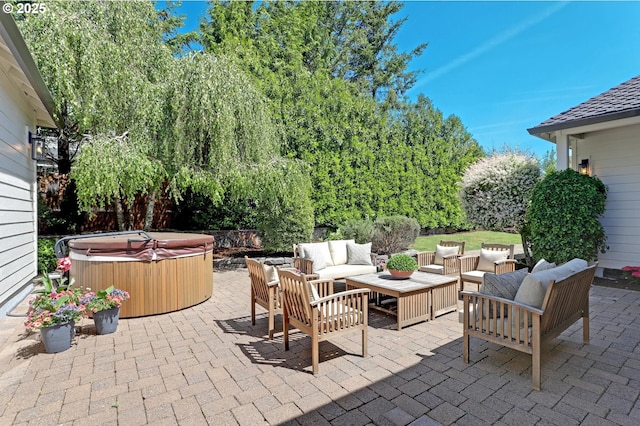 view of patio / terrace featuring a hot tub and an outdoor hangout area