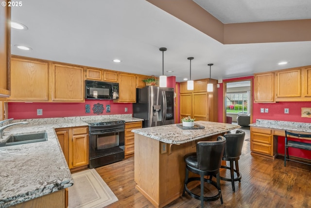 180 NE 29th Dr, Gresham, OR 97030 - kitchen with black appliances, a sink, a kitchen island, dark wood finished floors, and recessed lighting