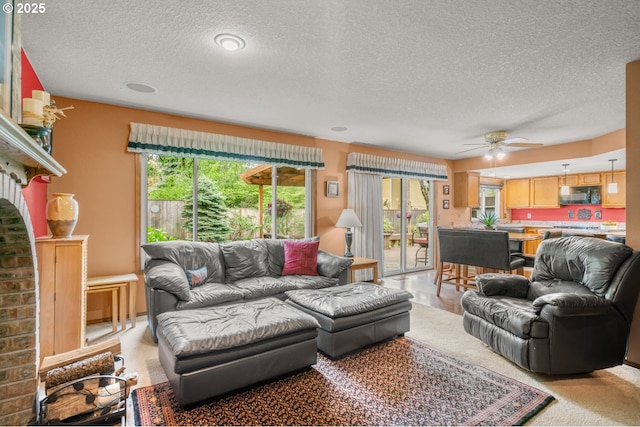 180 NE 29th Dr, Gresham, OR 97030 - living area with a textured ceiling, healthy amount of natural light, and ceiling fan