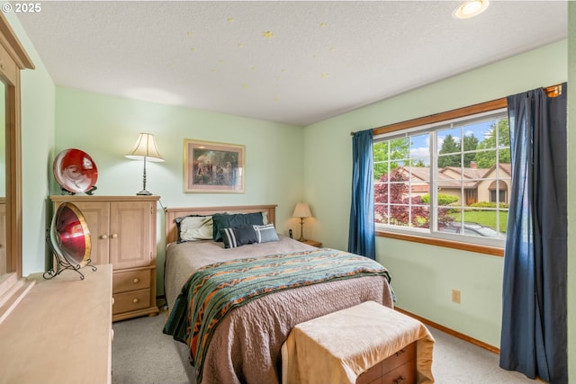 180 NE 29th Dr, Gresham, OR 97030 - bedroom featuring light colored carpet, a textured ceiling, and baseboards