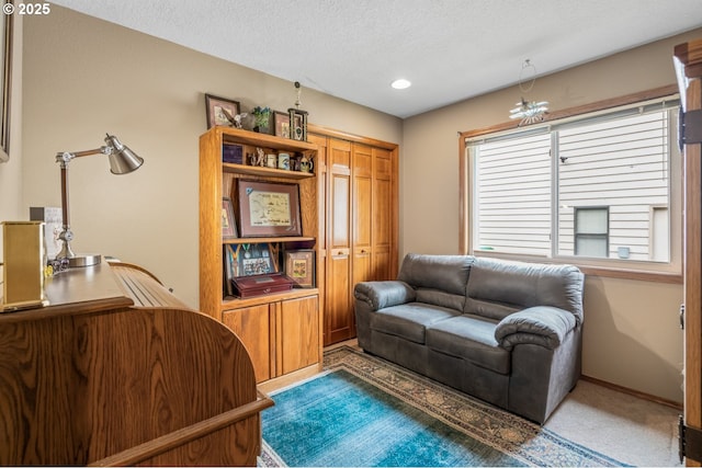 180 NE 29th Dr, Gresham, OR 97030 - carpeted living area featuring a textured ceiling, baseboards, and recessed lighting