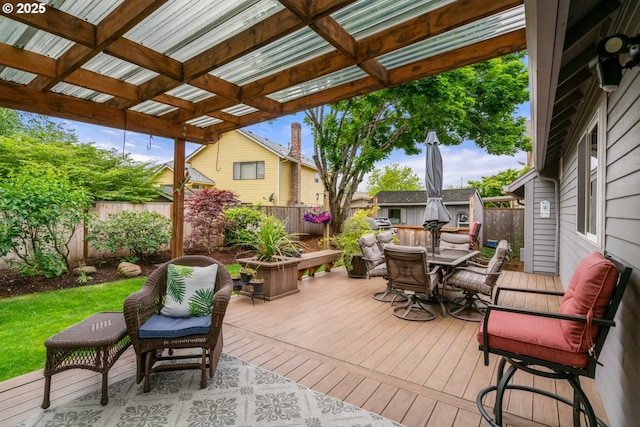180 NE 29th Dr, Gresham, OR 97030 - deck with outdoor dining space, a fenced backyard, an outbuilding, and a pergola