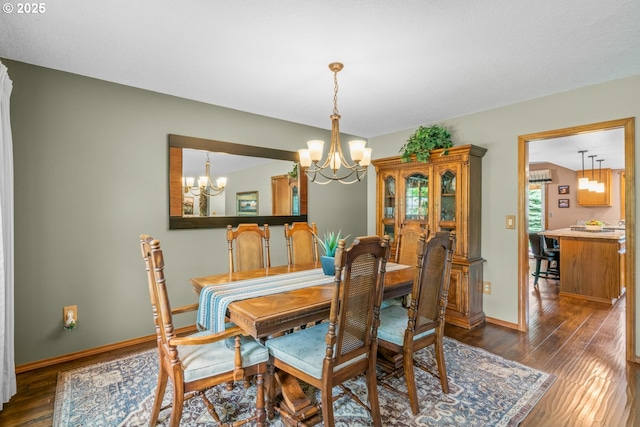 180 NE 29th Dr, Gresham, OR 97030 - dining room featuring a chandelier, dark wood finished floors, and baseboards