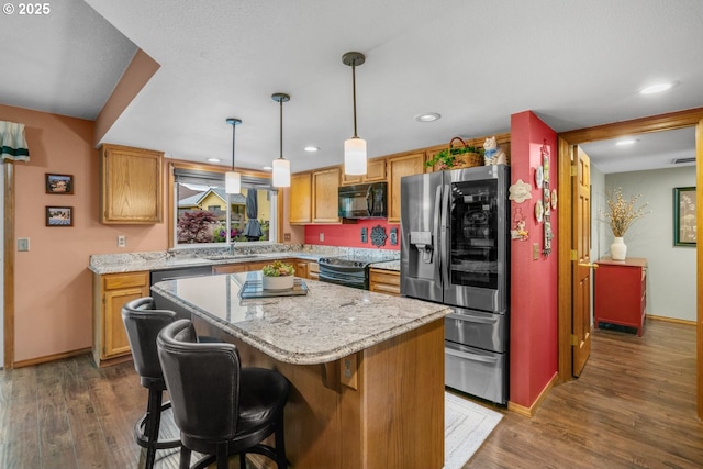180 NE 29th Dr, Gresham, OR 97030 - kitchen with black microwave, stainless steel fridge, electric range, a sink, and a kitchen island