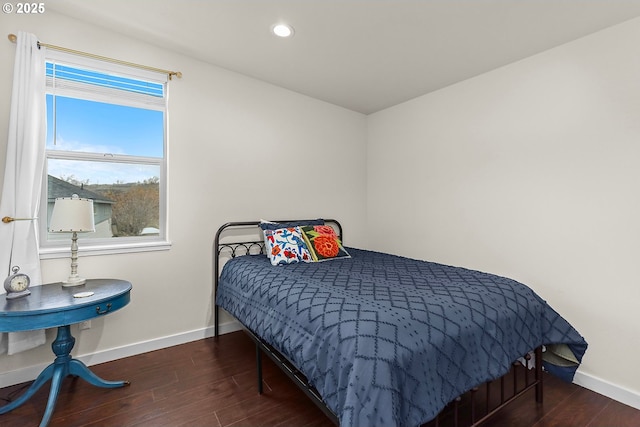 bedroom with baseboards, dark wood-type flooring, and recessed lighting