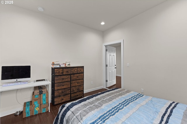 bedroom with baseboards, dark wood-type flooring, and recessed lighting