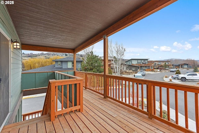 wooden terrace featuring a residential view