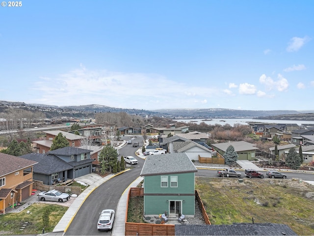 birds eye view of property with a residential view