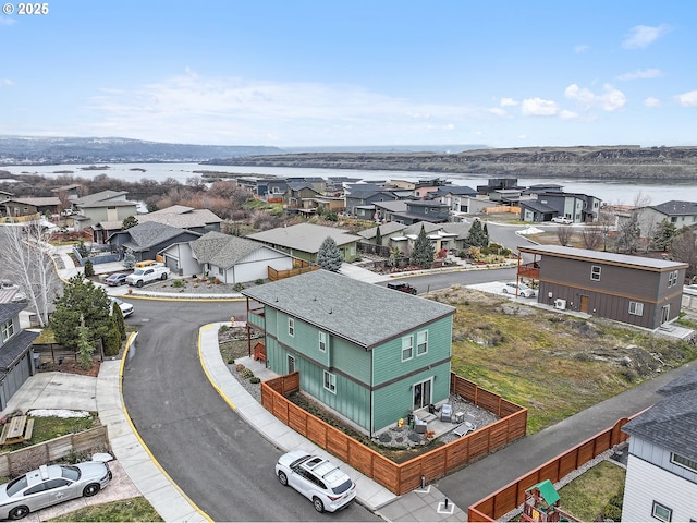 aerial view with a water view and a residential view