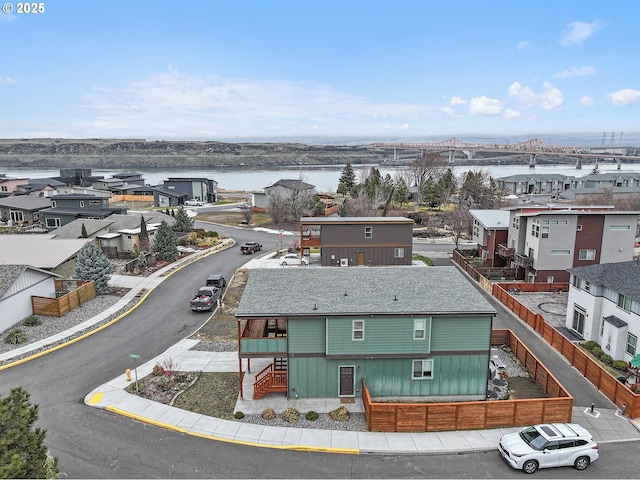 aerial view with a residential view and a water view