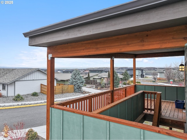 wooden terrace featuring a residential view