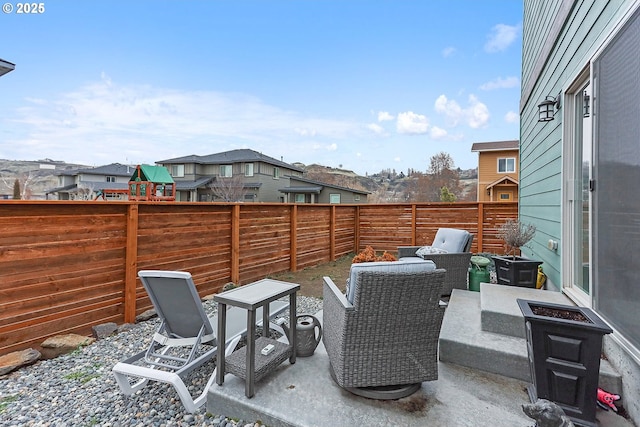 view of patio with a residential view and a fenced backyard