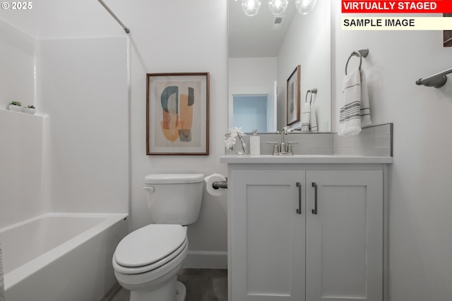 22987 Bland Cir, West Linn, OR 97068 - bathroom featuring baseboards, toilet, vanity, and tub / shower combination