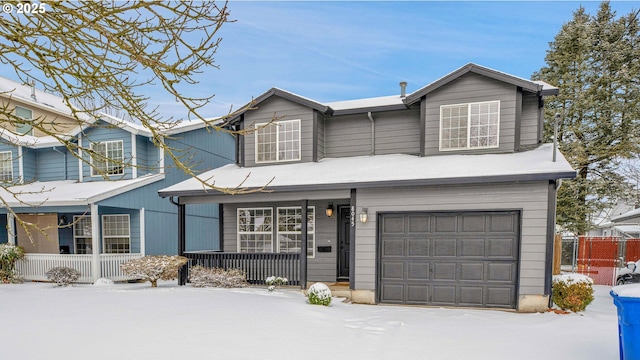 view of front of house with a garage and covered porch