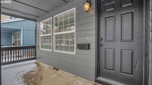 doorway to property featuring a porch