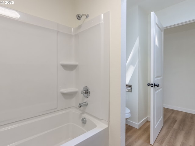 13928 SE Rhone St, Portland, OR 97236 - bathroom with toilet, wood finished floors,  shower combination, and baseboards
