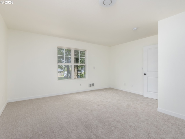 13928 SE Rhone St, Portland, OR 97236 - unfurnished room featuring baseboards, light colored carpet, and a smoke detector