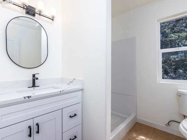 13928 SE Rhone St, Portland, OR 97236 - bathroom with toilet, vanity, tile patterned floors, and a shower