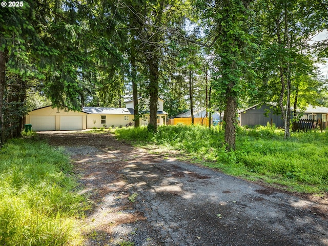 13928 SE Rhone St, Portland, OR 97236 - view of yard featuring a detached garage