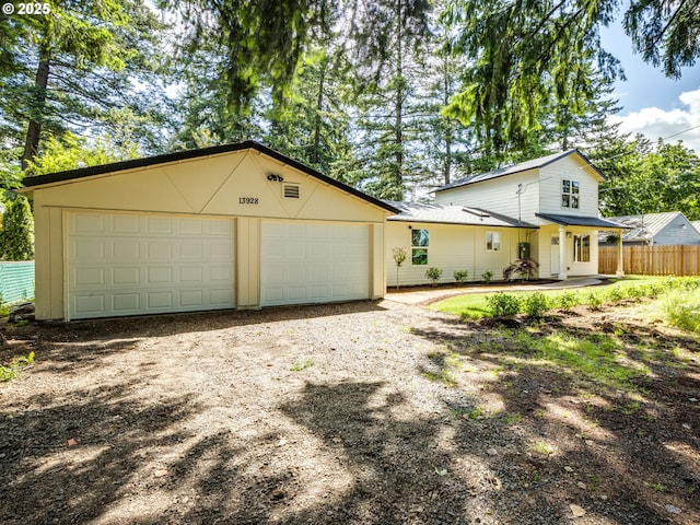 13928 SE Rhone St, Portland, OR 97236 - view of front of house with driveway and a garage