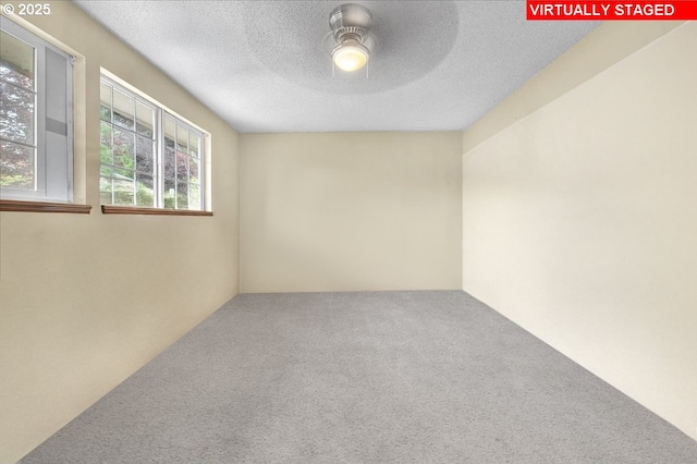 162 Monticello Dr, Longview, WA 98632 - unfurnished room featuring carpet, a ceiling fan, and a textured ceiling