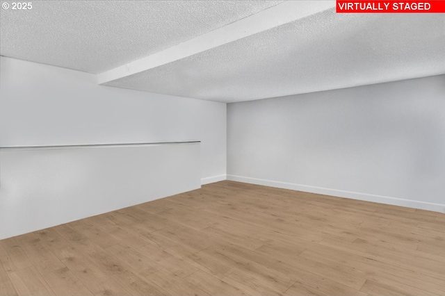 162 Monticello Dr, Longview, WA 98632 - unfurnished room featuring light wood-style flooring and a textured ceiling