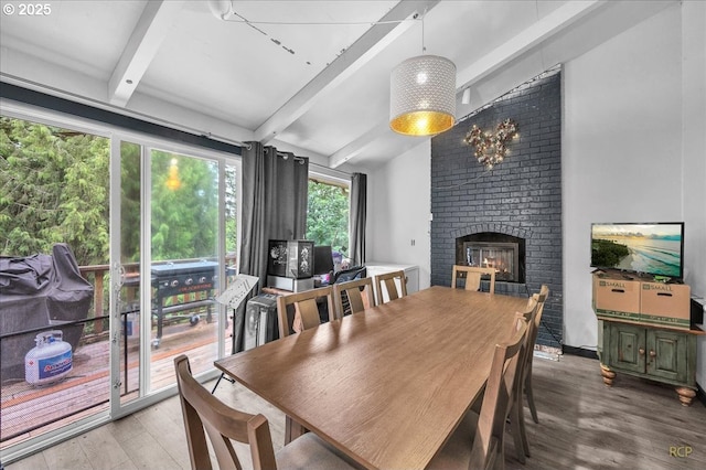162 Monticello Dr, Longview, WA 98632 - dining room with light wood-type flooring and a brick fireplace