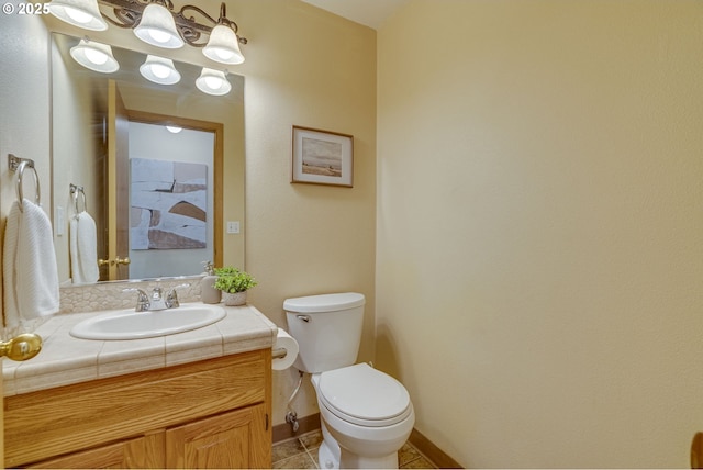 3057 Raymond St, Forest Grove, OR 97116 - half bathroom featuring vanity, toilet, tile patterned flooring, and baseboards