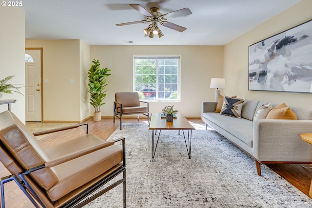 3057 Raymond St, Forest Grove, OR 97116 - living room with wood finished floors, a ceiling fan, and baseboards