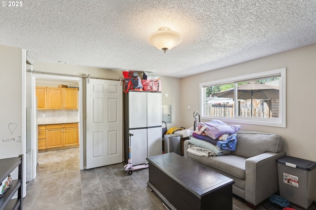 6855 SW Briarcliff Cir, Beaverton, OR 97008 - living room with a barn door and a textured ceiling