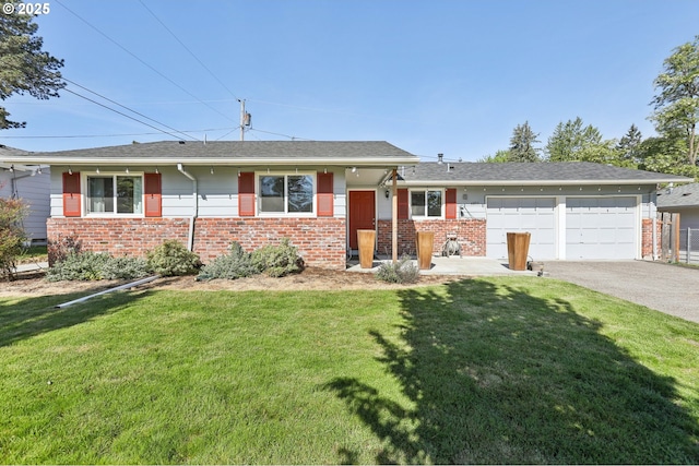 single story home featuring brick siding, an attached garage, asphalt driveway, and a front lawn