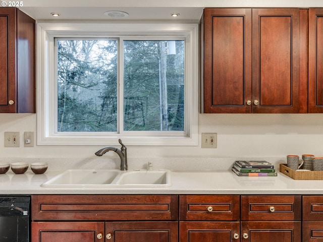 kitchen featuring black dishwasher and sink