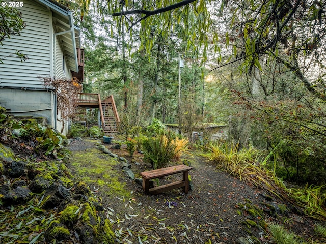 view of yard with a wooden deck