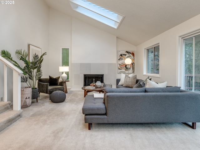 carpeted living room featuring vaulted ceiling