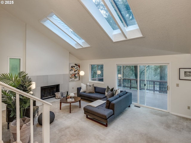 living room with a fireplace, carpet, and vaulted ceiling