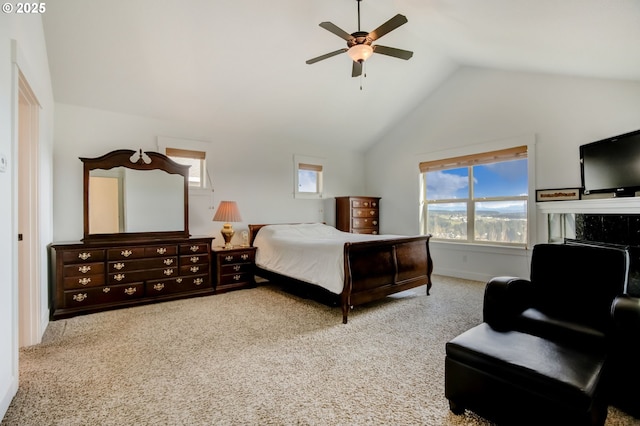 bedroom featuring baseboards, a ceiling fan, carpet, and vaulted ceiling