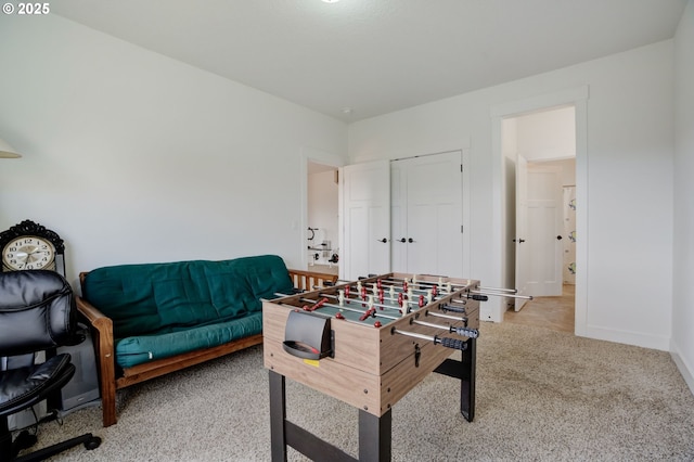 rec room with carpet flooring and baseboards