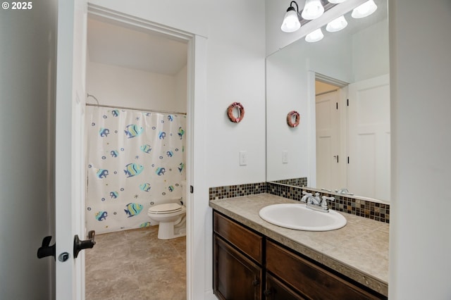 bathroom with toilet, vanity, a shower with shower curtain, and decorative backsplash