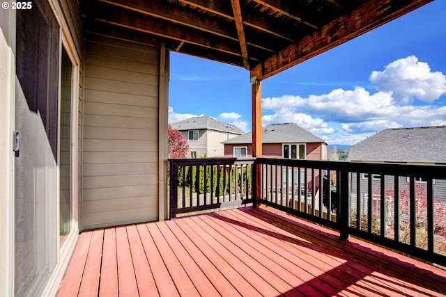 wooden deck featuring a residential view