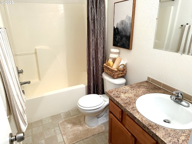 bathroom featuring a textured wall, shower / bath combo, vanity, and toilet